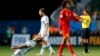 Argentina's players celebrate near Belgium's Marouane Fellaini, left, after winning their 2014 World Cup quarter-finals, Brasilia national stadium, July 5, 2014.