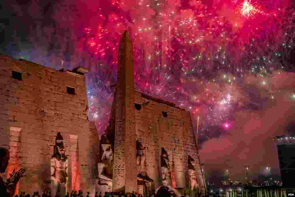 Celebratory fireworks fill the sky over Luxor Temple on Nov. 25, 2021 in Luxor, Egypt. (Hamada Elrasam/ VOA)