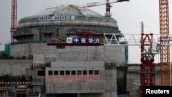 资料照：广东省台山核电站一个正在兴建中的核反应堆。（路透社 2013年10月17日）