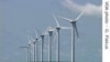 Giant wind turbines dot the landscape at the Darling Wind Power national demonstration project near Cape Town. 