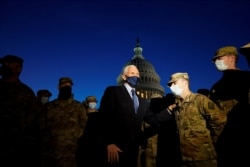 Vice President Mike Pence speaks to National Guard troops outside the U.S. Capitol, Jan. 14, 2021.