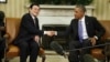 President Barack Obama shakes hands with Vietnam's President Truong Tan Sang during their meeting in the Oval Office at the White House in Washington, July 25, 2013.