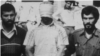 FILE - An American hostage is paraded before a crowd outside the U.S. embassy compound in Tehran, Iran, Nov. 9, 1979.