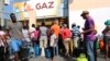 Haitians Seek Water, Food as Businesses Reopen After Protest