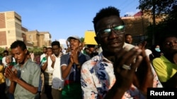 Sudanese protesters chant slogans during a rally calling for the former ruling party to be dissolved and for ex-officials to be put on trial in Khartoum, Oct. 21, 2019. 