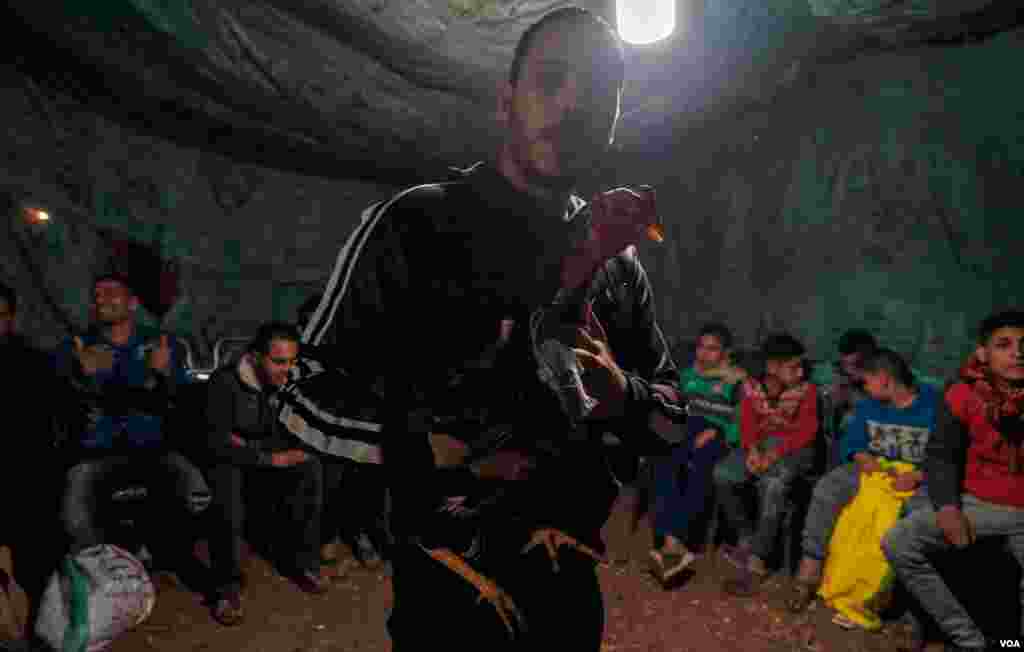 Ahmed Gamal, 28, owner of the winning Indian rooster named Max, says, "I am glad he did not lose an eye, I will put him for more fighting matches but not tonight." (H. Elrasam/VOA)