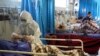 Scarcity Of Protective Gear Threatens Lives Of Exhausted Iran Medical Staff
