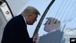 President Donald Trump walks up the steps of Air Force One at Andrews Air Force Base in Md., Saturday, Dec. 2, 2017. Trump is heading to New York to attend Republican fundraisers.