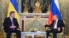 Russian President Vladimir Putin, right, and his Ukrainian counterpart Viktor Yanukovych talk during their meeting in Moscow, Dec. 17, 2013.