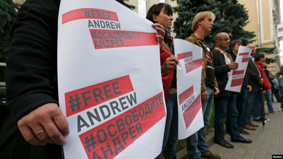 Demonstrators near the Ukraine embassy in Moscow seek information about missing Russian photographer Andrei Stenin on Aug. 26, 2014. His death was confirmed Sept. 3, 2014. 