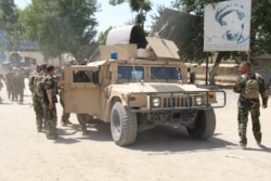 Afghan commando forces are seen at the site of a battlefield where they clashed with Taliban insurgents in Kunduz province, Afghanistan, June 22, 2021.