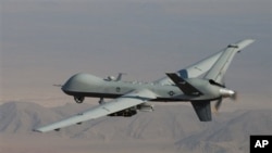 FILE - A U.S. Reaper drone patrols the skies in southern Afghanistan near the frontier with Pakistan.