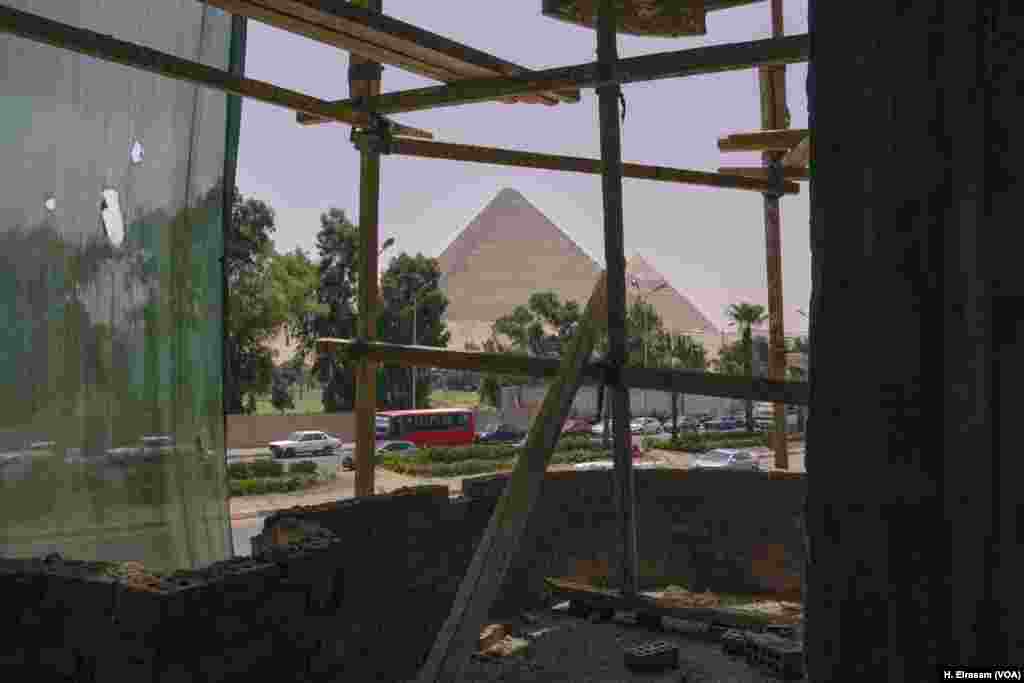 A view of pyramids at Giza from a building under construction. Urban sprawl in Egypt is threatening not only agricultural land but also the country’s cultural heritage. And yet, government figures show the majority of Egypt’s population lives on 6 percent of the land.