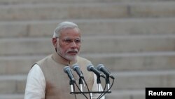 FILE - India's Prime Minister Narendra Modi takes his oath at the presidential palace in New Delhi May 26, 2014