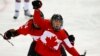 Canada's Meghan Agosta-Marciano celebrates after scoring what turned out to be the game-winning goal on Team USA's goalie Jessie Vetter (not shown) during their women's ice hockey game at the Sochi Winter Olympics, Feb.12, 2014.