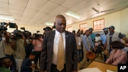 Botswana's President Mokgweetsi Masisi arrives to vote in general elections in Moshupa, west of Gaborone, Botswana, Oct. 23, 2019. 
