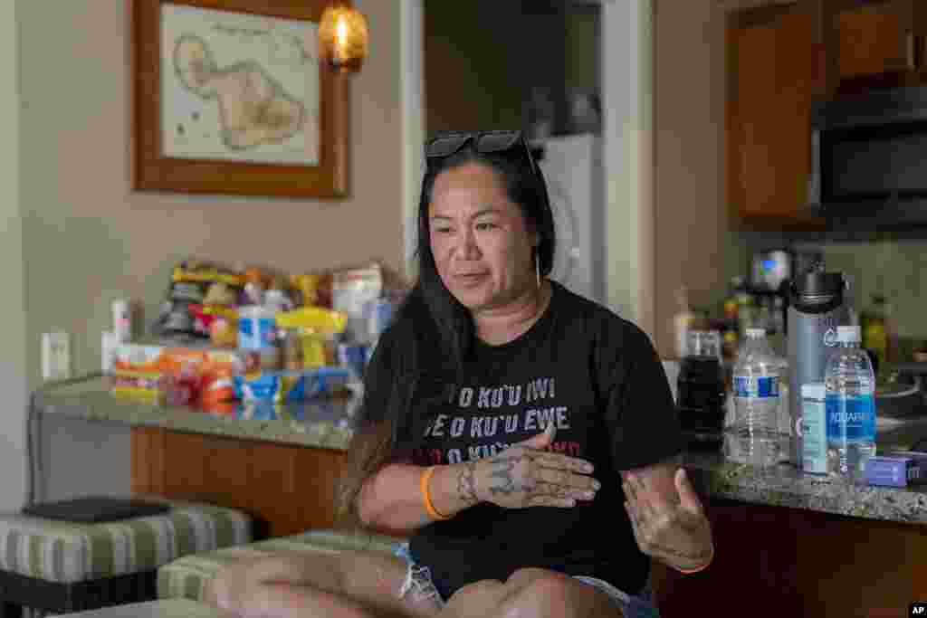 Tiffany Teruya talks about her opinions on housing and education issues affected by August's wildfire on Oct. 3, 2023, in Lahaina, Hawaii. Teruya's two-bedroom apartment at Kaiaulu o Kupuohi, a 89-unit affordable rental housing, burned down from August's wildfire.