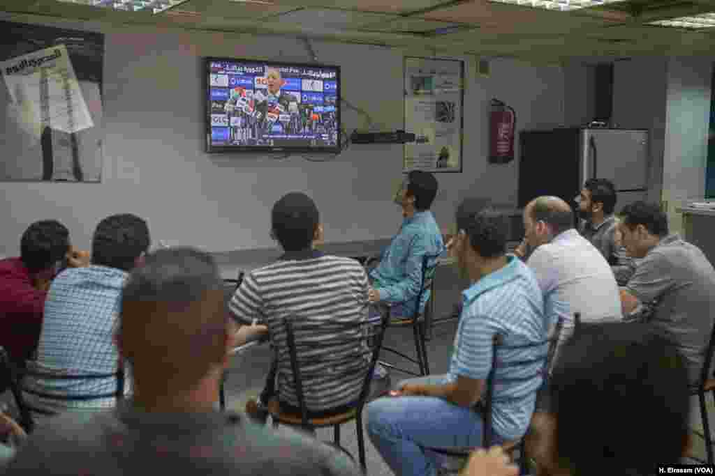 After Egypt’s disqualification in Russia, Egyptian football fans watch a press conference at the headquarters of the Eyptian Football Association, where EFA President Hani Abo Rida explains the shortcomings of the team and its sponsors.