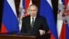 FILE - Russian President Vladimir Putin addresses the annual meeting of the Defense Ministry board in Moscow, Dec. 21, 2021. 