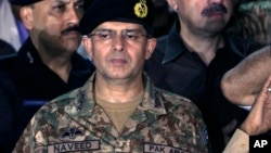 FILE - In this July 26, 2016 photo, Lt. Gen. Naveed Mukhtar attends funeral prayers in Karachi, Pakistan. 
