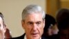 FILE - Special Counsel Robert Mueller departs after briefing members of the U.S. Senate on his investigation into potential collusion between Russia and the Trump campaign on Capitol Hill in Washington.