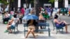FILE - People surf the Internet at a Wi-Fi hotspot in Havana, Cuba, Nov. 25, 2015.