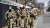 National Guard soldiers walk near the Capitol, March 4, 2021, on Capitol Hill in Washington.