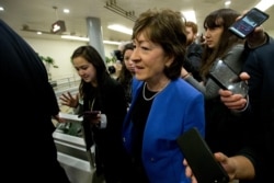 FILE - Senator Susan Collins (R-Maine) talks to reporters before attending the impeachment trial of President Donald Trump, January 28, 2020, on Capitol Hill in Washington.