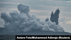 Mount Anak Krakatau volcano spews hot ash during an eruption as seen from Indonesian Naval Patrol Boat, KRI Torani 860, at Sunda Strait in Banten, Indonesia, Dec. 28, 2018.