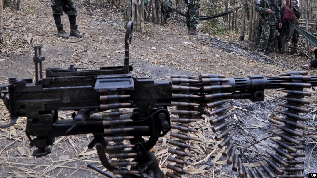 Karen National Union (KNU) soldiers stand guard with their assault weapons at Oo Kray Kee village in Karen State near Thai-Myanmar border on January 30, 2012. The Karen National Union (KNU) is waging the world's longest-running insurgency, launched 63 yea