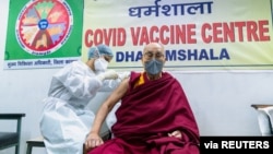 Tibetan spiritual leader, the Dalai Lama, receives a dose of coronavirus disease (COVID-19) vaccine at a vaccination centre in Dharamsala, India, March 6, 2021. (Office of his holiness the Dalai Lama/Handout via Reuters)
