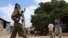 FILE - A Somali soldier patrols a street following a bombing in Afgoye, Somalia, Oct. 19, 2016.