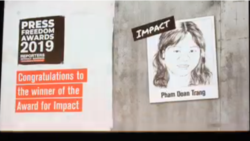 FILE - Reporters Without Borders (RSF) awarded Vietnamese journalist and blogger Pham Doan Trang a 2019 Press Freedom Prize for Impact, Sept. 12, 2019, in Berlin.