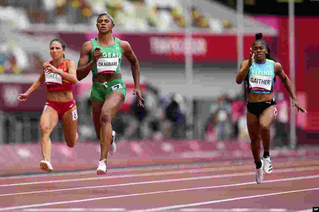 Blessing Okagbare, of Nigeria, wins a heat in the women's 100-meter run at the 2020 Summer Olympics, Friday, July 30, 2021, in Tokyo. (AP Photo/Petr David Josek)