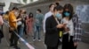 China Backs Calls for Probe of COVID Origins - But Not Now