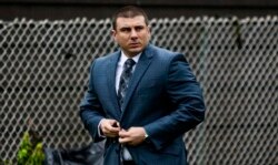FILE - New York City police officer Daniel Pantaleo leaves his house in Staten Island, New York, May 13, 2019.