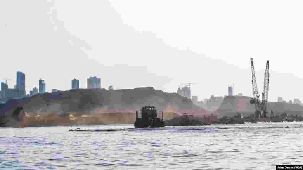 The new site is shown where waste is being dumped into the sea as part of efforts to reclaim land.