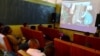  A group watches their movie at the Bioscope Independent Cinema after making a film at the Home Movie Factory in Johannesburg, South Africa. (Peter Cox/VOA)