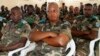 FILE - Congolese soldiers follow proceedings during the mass trial of 39 soldiers inside a military court in Goma in eastern Democratic Republic of Congo, May 5, 2014. 