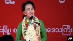 Myanmar's opposition leader Aung San Suu Kyi speaks during an election campaign for her National League for Democracy party, Sept 27, 2015.