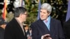 U.S. Treasury Secretary Jack Lew (L) talks with Secretary of State John Kerry on the White House South Lawn in Washington, D.C., Feb. 11, 2014. 
