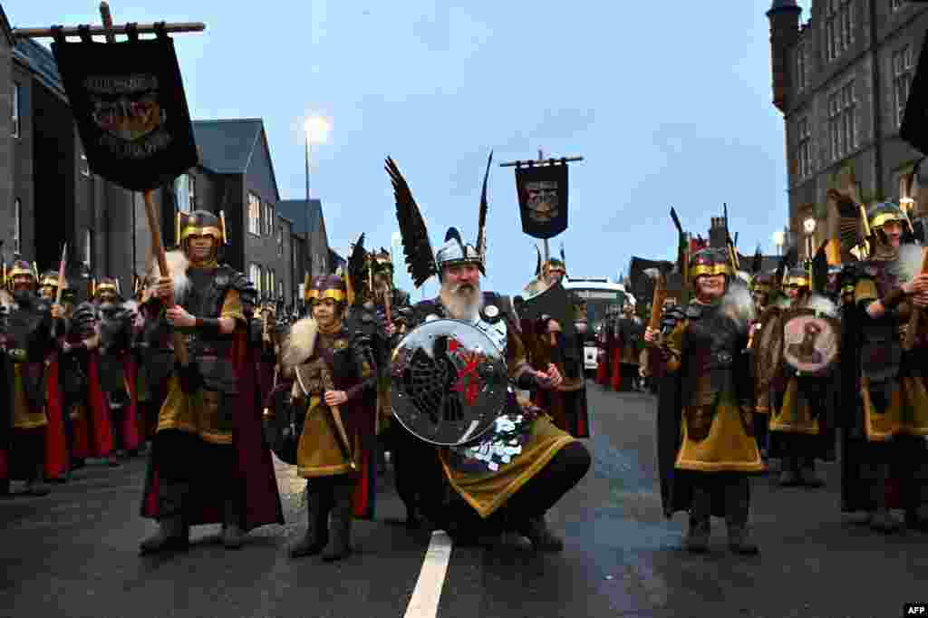Members of the Up Helly Aa 'Jarl Squad' parade through the streets of Lerwick, Shetland Islands, before the Up Helly Aa festival later in the day.