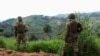 FILE - Members of the Democratic Republic of the Congo's army stand guard against the M23 rebel group in Lubero, North Kivu province, on Oct. 27, 2024. Officials said on Jan. 21, 2025, that M23 rebels recently have captured several key towns in South and North Kivu provinces.