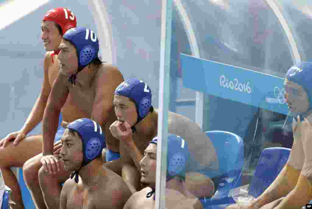 Japan players follow the game during men's water polo preliminary round match against Greece at the 2016 Summer Olympics in Rio de Janeiro, Brazil, Aug. 6, 2016.