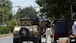 Afghan security personnel gather in front of a prison after an attack in the city of Jalalabad, east of Kabul, Afghanistan, Monday, Aug. 3, 2020. An Islamic State group attack on the prison in eastern Afghanistan holding hundreds of its members…