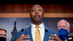 FILE - In this June 17, 2020, file photo, Sen. Tim Scott, R-S.C., accompanied by Republican senators speaks at a news conference on Capitol Hill in Washington.