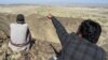 Seorang warga setempat menunjukkan sebuah gunung di daerah Koh-e-Sabz di provinsi Baluchistan, Pakistan barat daya yang menjadi sasaran serangan udara Iran, Kamis 18 Januari 2024.