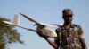 FILE - A soldier from the Uganda People's Defense Forces (UPDF) gives a demonstration on a Raven unmanned aircraft at the Kasenyi Special Forces Group barracks 40km (25 miles) south west of capital Kampala.