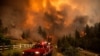 Firefighters battle the Tamarack Fire in the Markleeville community of Alpine County, California, July 17, 2021.