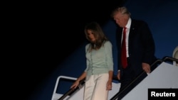 U.S. President Donald Trump and first lady Melania Trump arrive aboard Air Force One at the end of his first international trip as president, to Joint Base Andrews, Maryland, May 27, 2017.